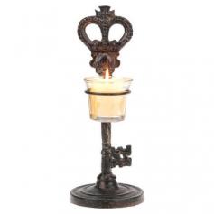 Crafted of cast iron in an ornate skeleton key silhouette, this candleholder adds a stately touch to your mantel or sideboard.   Pr...