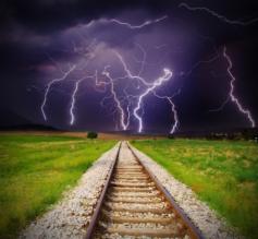 Railroad tracks and lightning..cool shot!