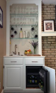 Built In Wet Bar - I converted an ugly, mirror-backed book shelf into this built in wet bar. The key pieces are: Summit Appliance 1.06 ft^3 Mini Refrigerator* (Home Depot). Sterling Drop-In Stainless Steel Bar Sink and Moen Anabelle Stainless 1-Handle Bar Faucet (Lowe's). *Note: Small return air grilles are installed in the top and side of the cabinet to provide adequate air flow for the mini fridge.