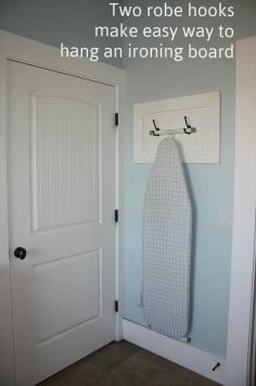 Make storing ironing boards less awkward: