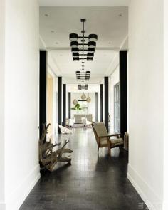 Make an Entrance. Dark wood floors and white walls in a Southampton Beach House. Interior Design: Haynes Roberts.