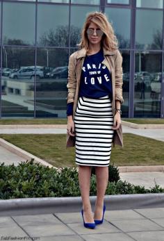 Black and white striped pencil skirt, navy graphic tee, navy heels, tan trench coat
