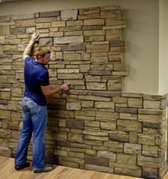 Faux stone sheets! Great idea for a basement accent wall