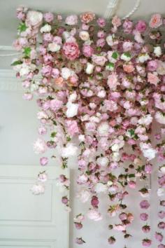 Fishing line and fake flowers make a beautiful backdrop.