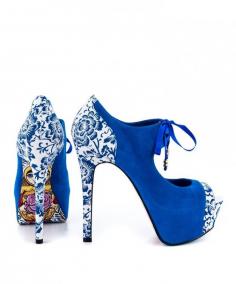 Nothing compares to the Nesta High Heels by TaylorSays. This fun style shoe features a bright blue fabric with beautiful floral trim. Underneath, a nesting doll is pictured on the sole with whimsical detailing. Creating a lift is 5 1/4 inch heel and 1 1/2 inch platform shoes.