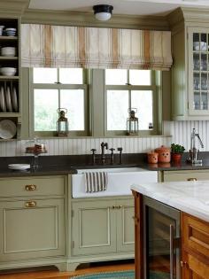 farm house sink. glass cabinets.and colored bottom cabinets. love...add some wood countertops and you would have perfection.