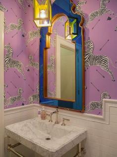 purple Scalamandre zebra paper with cobalt and gold mirror via The Zhush: Five Perfect Powder Rooms