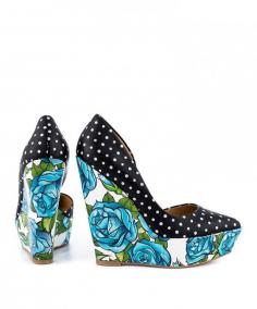 Get bodacious in the Bonafide! This flirtatious pump features a black and white polka dot upper, with D'orsay design and pointed toe. Beautiful blue floral print fully envelopes the sleek wedges and sturdy platform. Designed by, Taylor Says.