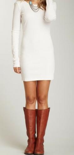 Long sleeve white dress with boots.