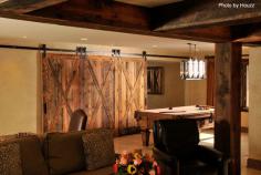 Remodeled basement with one our favorite new features - the barn doors. It's the hot trend! #barndoors #basements