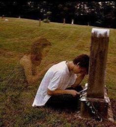 A visitor in a cemetery took a photo, and when she had the film developed, this apparition showed up on the picture - no one else was in the cemetery at the time she was there and took the picture.