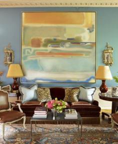 Miles Redd living room. Love the modern artwork with the antique rug, custom upholstered velvet couch, coordinating pillows and silk velvet leopard pillows.