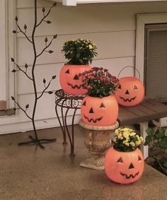 Trick or treat buckets as planters-cute and cheap!