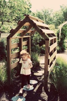 
                        
                            a pallet playhouse tiny recycled diy shack fort side of house with clematis or climbing vine going up. Arbor
                        
                    