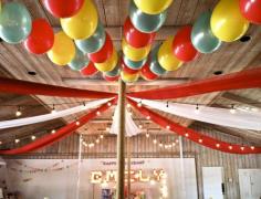 
                    
                        Circus-Themed Party Decor - love the lights, fabric and balloons that really bring this circus party to life! #partyidea #kidsparty
                    
                