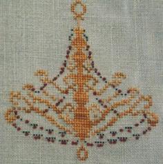 
                    
                        Festive Light is the title of this cross stitch pattern from Hot House Petunia.
                    
                