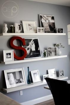 
                    
                        Awesome photo wall with shelves and a monogram. This would be great in my dining room.
                    
                