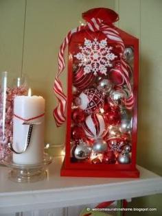 
                    
                        Give an old lantern a new purpose! A little red spray paint, a string of white lights, a snowflake ornament from the dollar store and fill it up with misc. red n white and silver ornaments.
                    
                