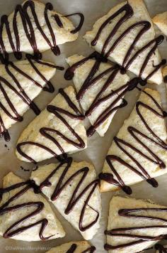 
                    
                        These cream scones drizzled with chocolate are a delicious dessert or treat for serving with coffee, hot chocolate or tea.
                    
                