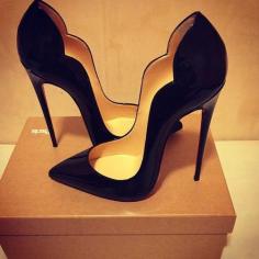 
                    
                        Black shining stylish high heels
                    
                