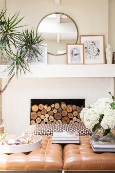 
                    
                        living room // great mantle & leather ottomans
                    
                
