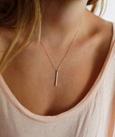
                    
                        simple gold bar necklace.
                    
                