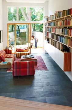 
                    
                        Modern living room with textured black slate tile floor
                    
                