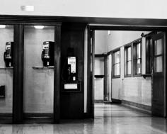 
                    
                        Old school telephone booth at a station.  Love this picture in black and white.  Photography
                    
                