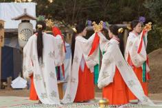 Dec. 17, 2009: These are miko shrine maidens performing a special Shinto Shaden Kagura dance ritual during the annual On-Matsuri festival, a traditional Shinto religious festival held at the Kasuga Wakamiya Shrine in the ancient Japanese city of Nara, Japan. In older days, miko were considered shamans, but today they take on a more lighter role as priestesses or ceremonial duties. The traditional miko costume is an elaborate multi layered costumed kimono comprised of a red hakama (long, kimono type trousers), a white haori or kimono outer layer, white or red hair ribbons (white symbolizes purity), and in the case of Kasuga Shrine miko, they wear wisteria flowers in their headdress,  symbolic if the shrine's patron the Fujiwara clan. ..This festival which dates back to the twelfth century was first started by Tadamichi Fujiwara, Chief Advisor of the Emperor in 1136 as a way to pray for the eradication of a plague as well as hopes of a bumper crop in the coming year. For many centuries this festival included both Shinto and Buddhist participants, but when Shinto was made the official state religion during the Meiji period (1867-192), the government instituted a policy of separation between Buddhism and Shinto. Ever since, this festival has strictly been a Shinto ceremony held every December 17 on the grounds of Kasuga Taisha Grand Shrine, which Kasuga Wakamiya Shrine is a branch of. During the festival, the Divine Spirit of Wakamiya is temporarily enshrined in the Otabisho, a special shrine set up for just this festival. Several official religious rites are performed throughout the day, as well as the Jidai Gyrotesu, or "Precession of Eras" in which parade participants displays traditional Japanese costumes from various era of Japanese history. There are also displays of court music and dance which goes on well into the night.