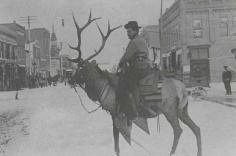 Is this real! man riding an elk