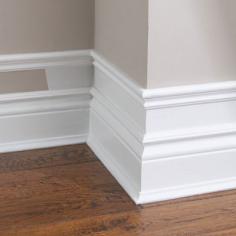 DIY - Make your baseboard more dramatic...add small pieces of trim to the top of existing baseboard, add a few inches and add another piece of molding. Paint the wall and trim white. Cheap Easy!!! This also works for crown mold!