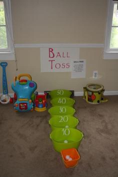 
                    
                        Ball Toss.   Would also make a great "rainy day" activity.  You could even find tubs or buckets of varying sizes (like nesting bins) for more of a challenge for the older kids (Think Skee-ball).
                    
                