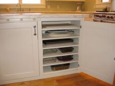 Baking pan storage. Slightly wider spaced shelves would be good for casserole dishes too