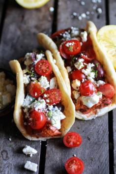 Greek Salmon Souvlaki Gyros with Tzatziki | Fresh tomatoes, salty olives, pita bread, artichokes, greek yogurt.  Feta! Yeah, I think feta is my very favorite.