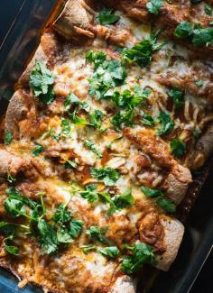 Vegetarian Spinach, Artichoke & Black Bean Enchiladas with a Simple Homemade Red Sauce | Cookie + Kate. #vegetarian #vegetable #spinach #artichoke #blackbean #dinner #lunch #mexican #enchilada #recipes