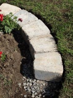 Mow-over flower bed edging - this is how all of our garden edging is done.  Saves so much time not having to weed eat afterwards.