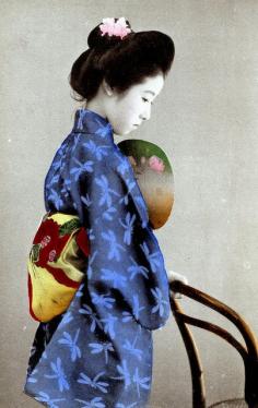 Dragonfly Kimono 1905. A Japanese Beauty leaning on a bentwood chair. The dragonfly is a late summer to early autumn motif.