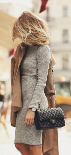 Grey skirt + cropped top set, camel coat, black quilted bag and white heels.
