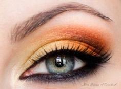 Powerful contrast: eye makeup for blue eyes. Black #eyeliner on the top eye lid over orange and copper #eyeshadow with black eyeshadow on the bottom eyelid and black eyeliner on the waterline. Make your #BlueEyes make a statement with this gorgeous contrast on these #AlmondEyes. #makeup #eyemakeup