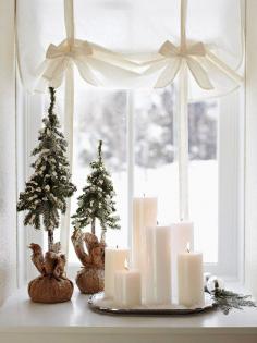 Holiday Decorating Ideas for Small Spaces  small Christmas trees in candle holders  all of them w/spray snow