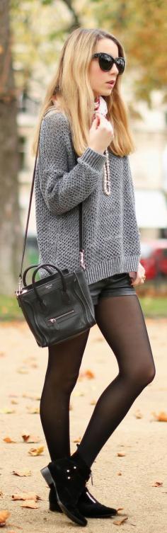 Street Style January 2014: Caroline Louis is wearing a  grey knit sweater from &Otherstories, leather shorts from TopShop, boots from Tabitha Simmons and the bag is from Céline