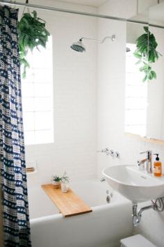 Nadia, Ryan, and Jake most recently tackled a redo of our one little bathroom. It’s simple and clean – just what the space called for. No fuss, no muss. Shower curtain by John Robshaw, bath board by Marvin #bathroom idea #bathroom design #bathroom inspiration #bathroom decor| http://bathroom-design-evert.blogspot.com