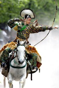 An #archer dressed in traditional #samurai garb displays Yabusame (archery while on horseback) during an annual demonstration of 13th century Japanese martial arts in Tokyo. (Yoshikazu Tsuno/AFP/Getty Images)