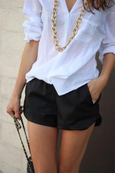 crisp white, gold chain, black shorts