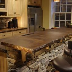 Stacked stone island with stained concrete counter top!