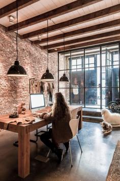 Loft in Amsterdam.  Love the exposed brick walls.