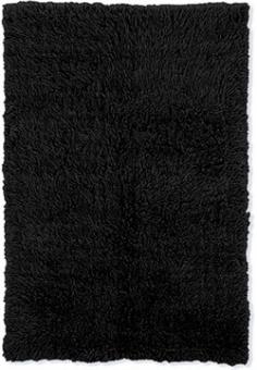 Beautiful black color complements most settings. Hand-woven in Greece of 100% New Zealand wool. Durable polypropylene warp with wool weft backing. Traditional Greek Flokati shag style. 1.5-inch pile height. Available in a choice of sizes Note: Due to individual computer monitor settings actual colors may vary slightly from those you see on your screen. The soft luxurious feel of the Linon New Flokati Black Area Rug has to be seen to be believed! An age-old Greek tradition that dates back to the 5th century A.D. Flokati rugs were the creation of the shepherds of Samarina who used these rugs primarily as clothing and bedding to stay warm during the harsh winter months. In the United States Flokati rugs have gained in popularity ever since shag style rugs became all the rage during the 1970s.Hand-woven in Greece of 100% New Zealand wool this beautiful rug features a durable polypropylene warp with wool weft backing that ensures it lasts for years. The beautiful black color complements most settings while the 1.5-inch pile height offers a luxurious shag style with a cool retro feel. To preserve the beauty and color of this rug professionally dry-clean as needed. Available in a choice of sizes this lovely area rug embodies a timeless elegance that can never be replaced by fickle trends. About Linon Home DecorLinon Home Decor Products has established a reputation in the market for providing the best trend-right products at the right price while offering excellent quality style and functional furnishings to every room in the home. Linon offers a broad selection of furnishings for today's discriminating and demanding retail environments. They offer outstanding values for every room; a total commitment of quality service and value that is unsurpassed in their industry. Size: 2.4 x 4.3 ft.