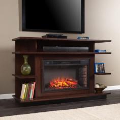 Make a stunning statement with the architectural design of this multi-colored stained media fireplace. Varying line extensions throughout enhance open space and add depth to the midcentury modern style. Use the media shelf for storing consoles, and the six open shelves for showcasing your favorite entertainment and decorative items. The widescreen firebox has realistic, multicolor flames and glowing embers with an interior brick design for a more lifelike look. This electric fireplace features energy efficient LED and requires no professional installation, making it a cost effective way to upgrade your living or media room. Easy to use remote control offers 4-way adjustability to warm the room conveniently. Safety features include automatic shutoff and glass that remains cool to the touch. Turn off the heat to enjoy the fireplace ambience year round! Features: Accommodates a flat panel TV up to 61W overall 33widescreen electric firebox - Supplemental heat for up to 400 square feet Features 7 fixed, open shelves Offers 1 cord management opening Supports up to: 85 lb. (mantel), 20 lb. (media shelf), 8 lb. (per shelf) Assembly required Batteries: 1 CR2025, included Materials: Poplar, MDF, Particle Board, Veneer, Metal, Glass, Resin Dimensions: 63"L x 19.5"W x 40"H Weight: 209 lbs