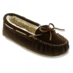 Pamper your feet in the aahhh-inspiring Minnetonka Cally Slipper. This indoor/outdoor women's lounge shoe boasts a supple suede upper lined in fluffy faux fur to surround your foot in cozy comfort; leather lacing and stitching details call out the traditional moccasin style. The Minnetonka Cally Slipper has a lightly padded footbed that supports as it cushions atop a rubber sole that offers traction and durability, inside or out.