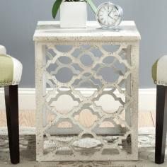 Inspired by a Moroccan iron architectural fragment, the Lonny end table brings an open and airy feel to transitional rooms. The strong rectangular shape of this piece contrasts the curved ogee double arch motif. Features: -Material: MDF. -Professional.